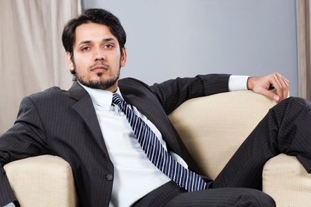Indian businessman relaxing on the sofaの写真素材