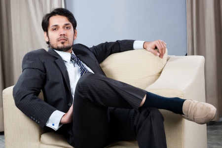 Indian businessman relaxing on the sofaの写真素材