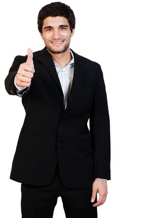 young and happy businessman with thumbs up, isolated on whiteの写真素材