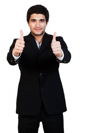 young and happy businessman with thumbs up, isolated on whiteの写真素材