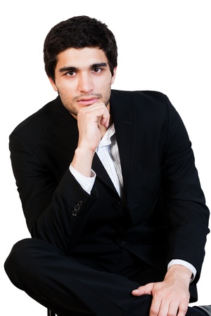 portrait of young happy businessman holding his chinの写真素材