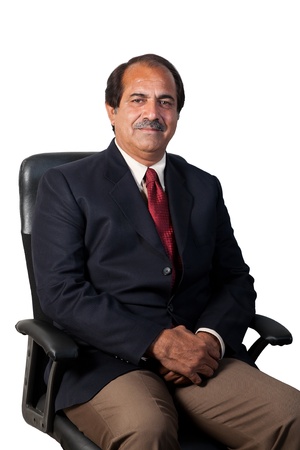 happy and confident senior businessman sitting in the office chair isolated on white backgroundの写真素材