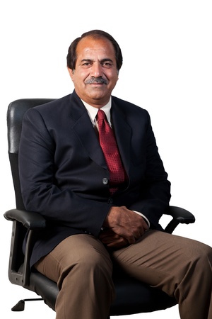 happy and confident senior businessman sitting in the office chair isolated on white backgroundの写真素材