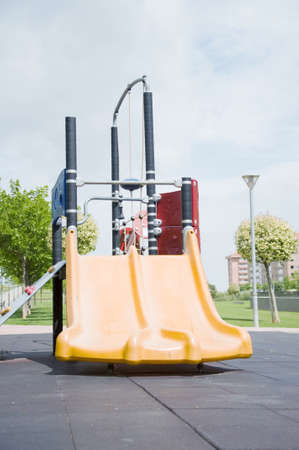 A double toboggan in a park for kidsの写真素材