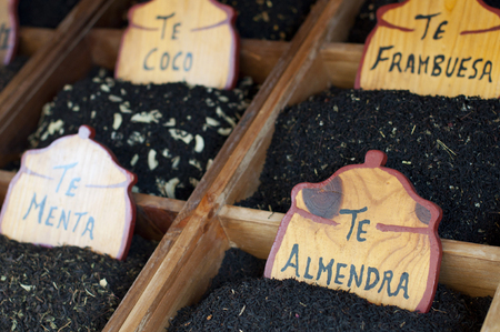Herbal teas in a fair stand labeled in Spanish.の写真素材