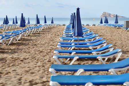 Empty sunbeds in the beach of Benidormの写真素材