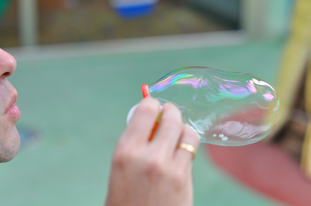 Man making some soap bubblesの写真素材