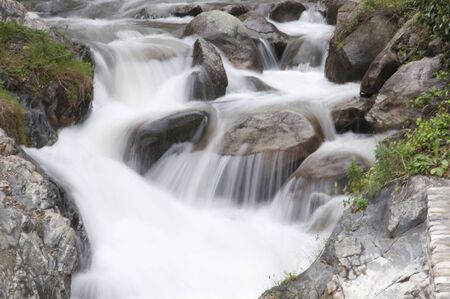 River falling through the mountain rocksの写真素材