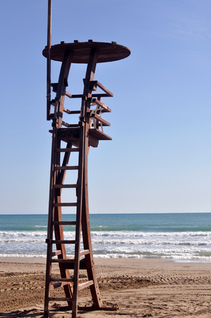 A lifeguard tower to protect the swimmers in the beachの写真素材