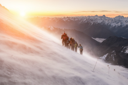 Elbrus, a group of climbers at dawn at an altitude of 5200mの写真素材