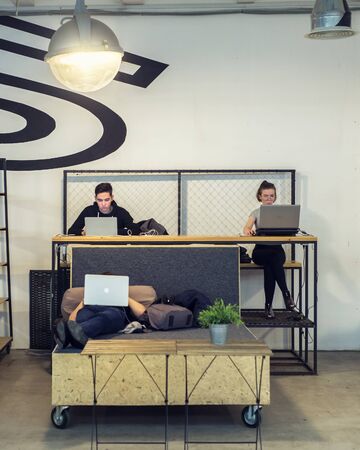 Kazan, Russia - 7 november 2019. Coworking people workplace laptop coffee photo editing interior minimalismのeditorial素材