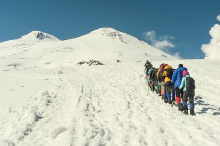 Climbing Elbrus group of climbers goes in the snow to the topの写真素材