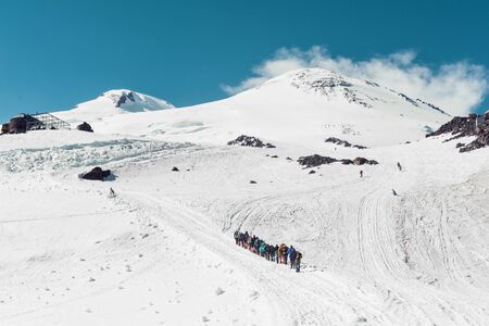 Climbing Elbrus group of climbers goes in the snow to the topの写真素材