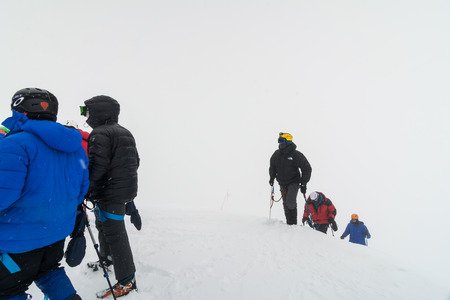 Caucasus / Russia - 07.15.2018 Group of climbers climbing mountain peaks.のeditorial素材
