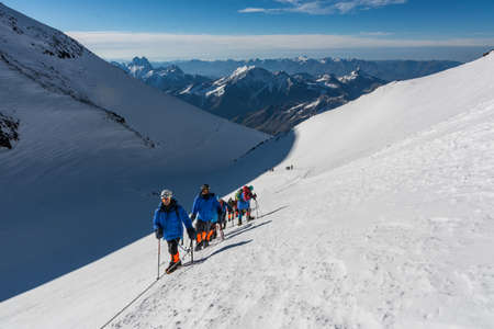 Caucasus / Russia - 09/09/2018 Group of climbers climbing mountain peaksのeditorial素材