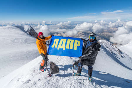 Caucasus / Russia - 07.23.2018 Group of climbers climbing mountain peaks.のeditorial素材