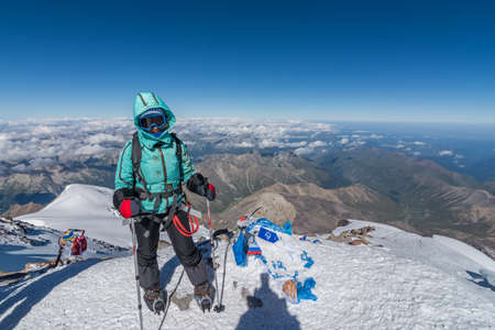 Caucasus / Russia - 06/08/2018 Group of climbers climbing mountain peak Elbrus