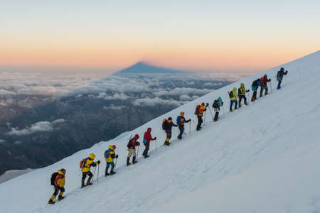 Caucasus / Russia - 06/08/2018 Group of climbers climbing mountain peak Elbrusのeditorial素材