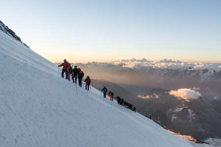 Caucasus / Russia - 06/08/2018 Group of climbers climbing mountain peak Elbrusのeditorial素材