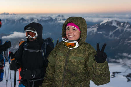 Caucasus / Russia - 06/08/2018 Group of climbers climbing mountain peak Elbrus