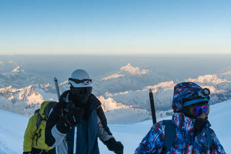 Caucasus / Russia - 22/06/2008 Group of climbers, acclimatization program in the mountains before climbing Mount Elbrus. Tourists take pictures on the background of high snowy mountain peaks.のeditorial素材
