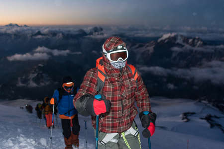Caucasus / Russia - 06/08/2018 Group of climbers climbing mountain peak Elbrus