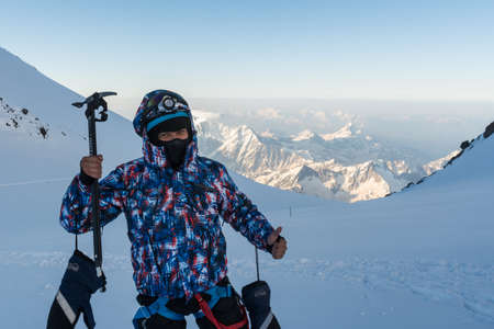 Caucasus / Russia - 22/06/2008 Group of climbers, acclimatization program in the mountains before climbing Mount Elbrus. Tourists take pictures on the background of high snowy mountain peaks.のeditorial素材