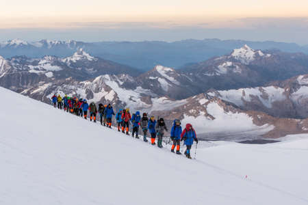 Caucasus / Russia - 09/09/2018 Group of climbers climbing mountain peaksのeditorial素材