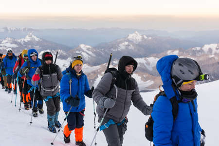 Caucasus / Russia - 09/09/2018 Group of climbers climbing mountain peaksのeditorial素材