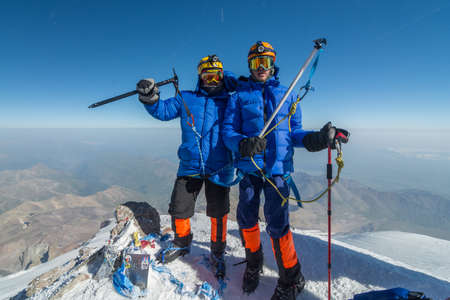 Caucasus / Russia - 07/31/2018 Group of climbers climbing mountain peaks.のeditorial素材