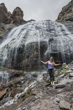 Caucasus / Russia - 02/06/2008 Group of climbers, acclimatization program in the mountains before climbing Mount Elbrus. Tourists take pictures on the background of high snowy mountain peaks.のeditorial素材