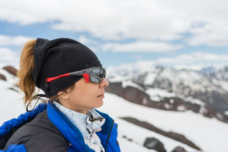 Caucasus / Russia - 02/06/2008 Group of climbers, acclimatization program in the mountains before climbing Mount Elbrus. Tourists take pictures on the background of high snowy mountain peaks.のeditorial素材