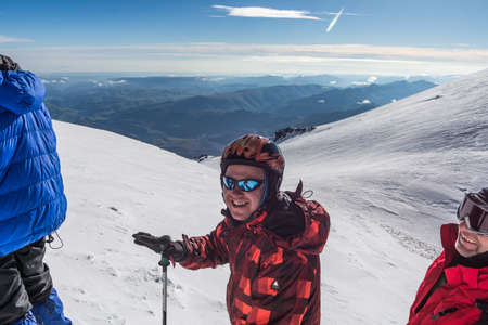Caucasus / Russia - 07.23.2018 Group of climbers climbing mountain peaks.