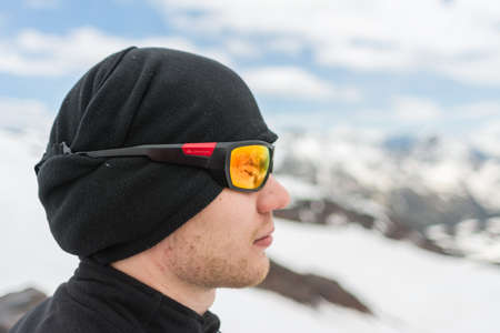 Caucasus / Russia - 02/06/2008 Group of climbers, acclimatization program in the mountains before climbing Mount Elbrus. Tourists take pictures on the background of high snowy mountain peaks.のeditorial素材