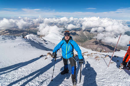 Caucasus / Russia - 07.23.2018 Group of climbers climbing mountain peaks.のeditorial素材