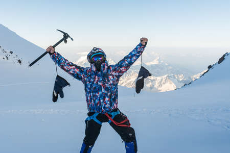 Caucasus / Russia - 22/06/2008 Group of climbers, acclimatization program in the mountains before climbing Mount Elbrus. Tourists take pictures on the background of high snowy mountain peaks.のeditorial素材