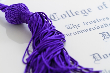 graduation tassle on a diplomaの写真素材
