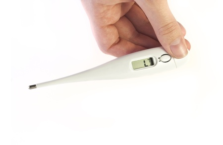 fingers holding electronic termometer on white background