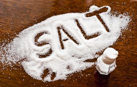 Salt written on counter in spilled salts 