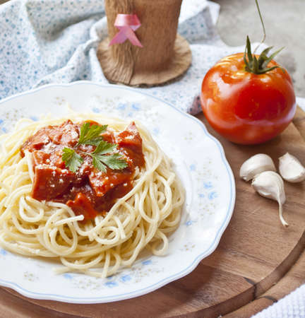 spaghetti with tomato sauce and ingredients の写真素材