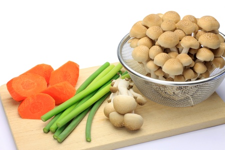 I cut vegetables on a cutting board I took it with a mushroom.の写真素材