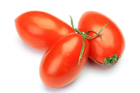I photographed several mini-tomatoes in a white background.の写真素材