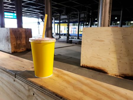Coffee Cup on the Train table nest to Window with Morning Lightの写真素材