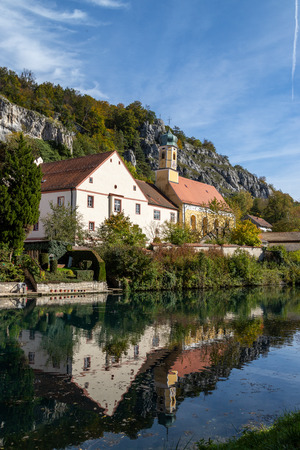 Idyllic view at the village Markt Essing in Bavaria, Germany with the Altmuehl river and high rocks on a sunny day in autumnのeditorial素材
