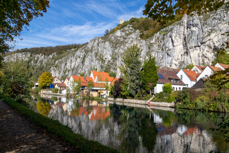 Idyllic view at the village Markt Essing in Bavaria, Germany with the Altmuehl river and high rocks on a sunny day in autumnのeditorial素材
