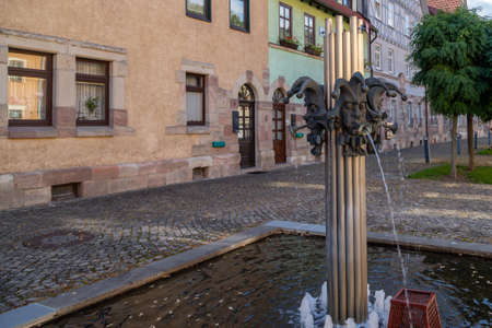 Fountain with fools heads in the Thuringian city of Wasungenのeditorial素材