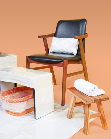 Interior of a home spa salon with chair, massage table and towelの写真素材