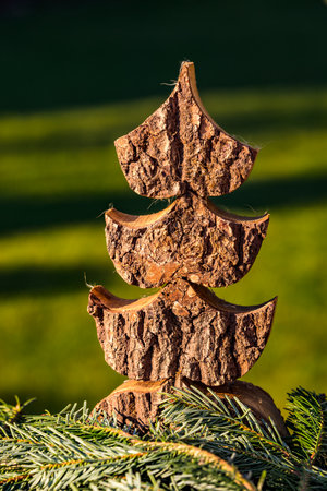 A self-made Christmas tree made of wood beautifully isolated against a green backgroundの写真素材