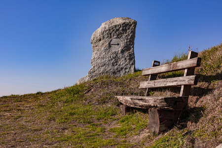 Take a break on a wooden park bench with a great viewの写真素材