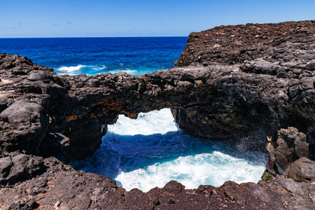 The natural lava stone bridge Pont Naturel in the east of the holiday island of Mauritius in the Indian Oceanの写真素材